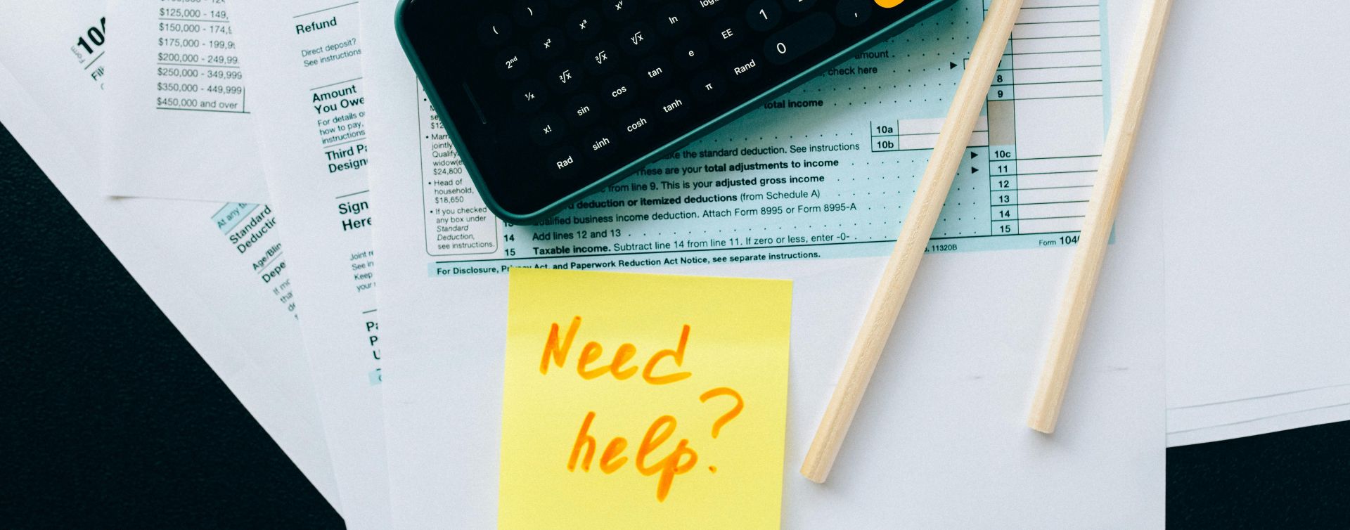 Black Smartphone on Top of Documents